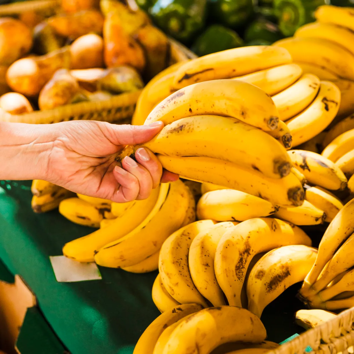 a photo of bananas in the supermarket