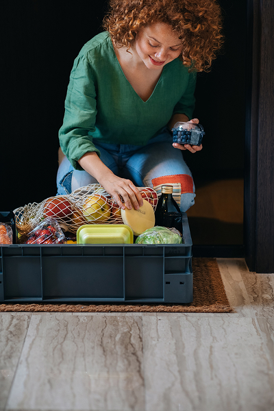 a woman picking up her online grocery order